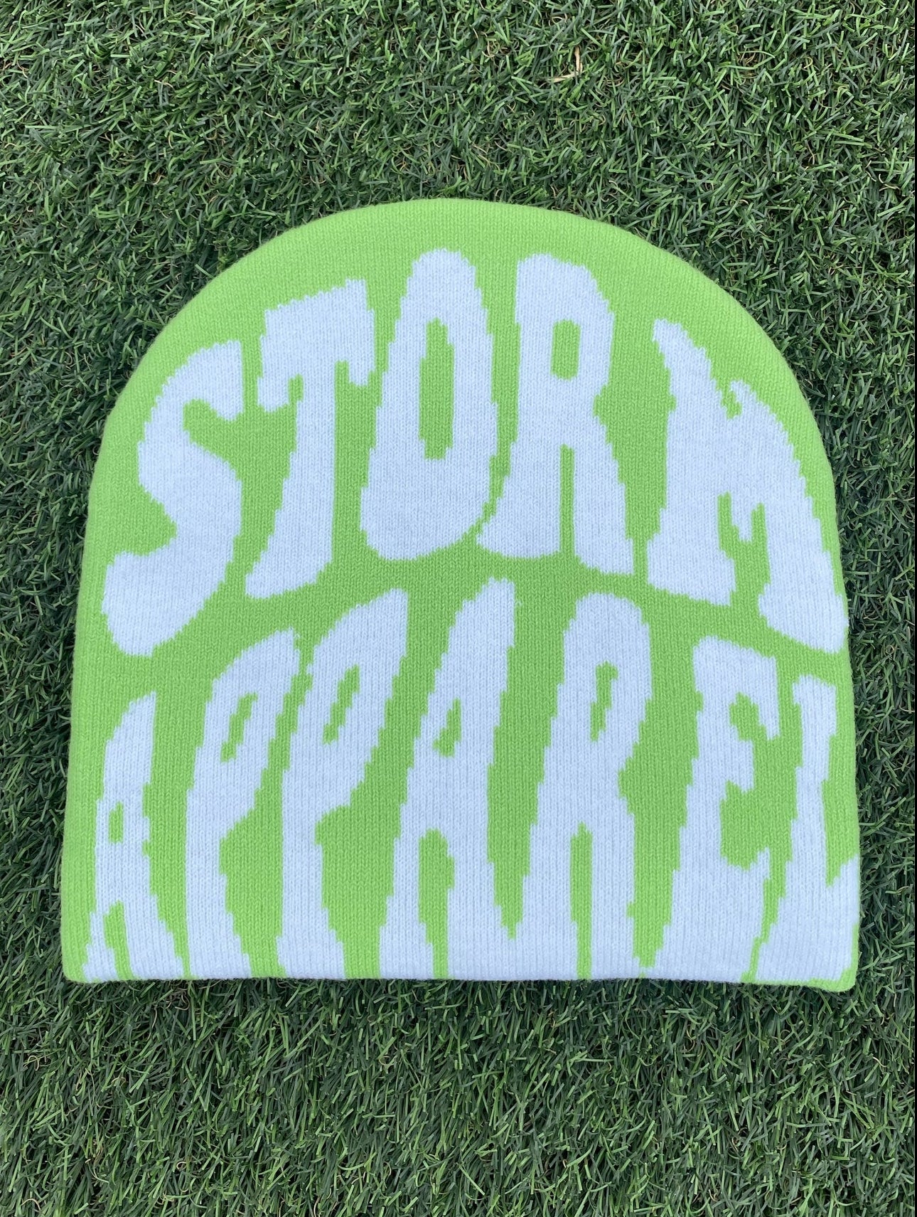 BONNET STORM APPAREL VERT ET BLANC.